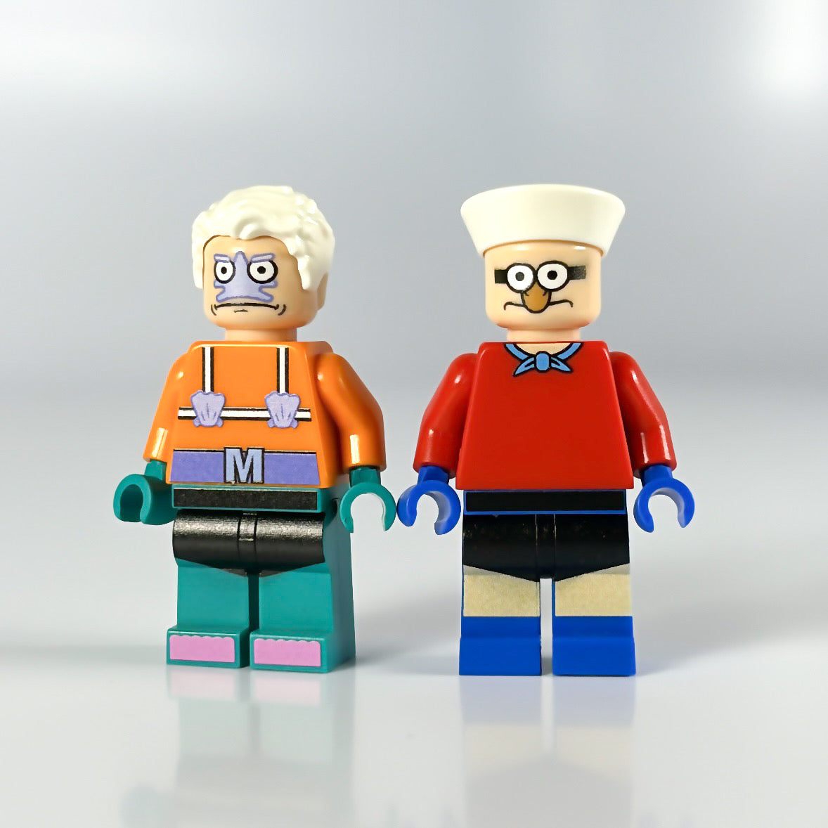 FigFabLabs Underwater Duo with two colorful underwater-themed figurines on a sandy surface