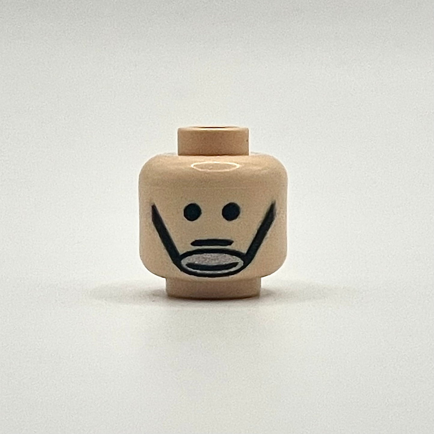 Classic Fleet Trooper Head LEGO minifigure piece with simple facial features and chinstrap design