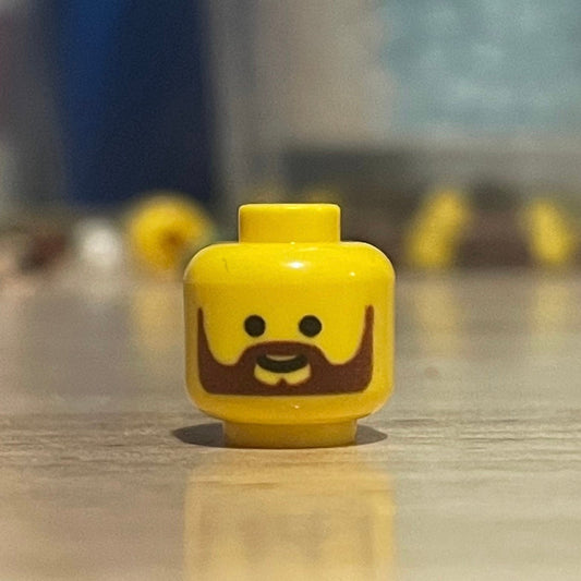 Arthur Head LEGO minifigure with trademark disclaimer text