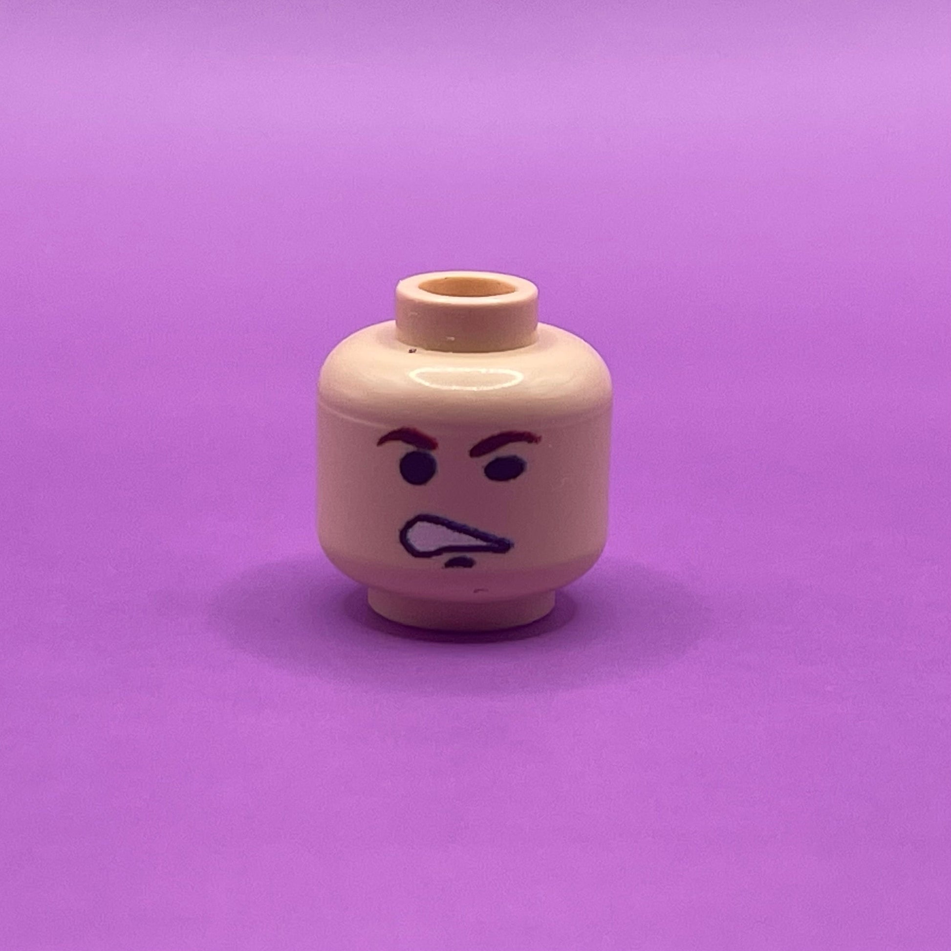 Classic Smuggler Head LEGO minifigure piece with angry facial expression on purple background