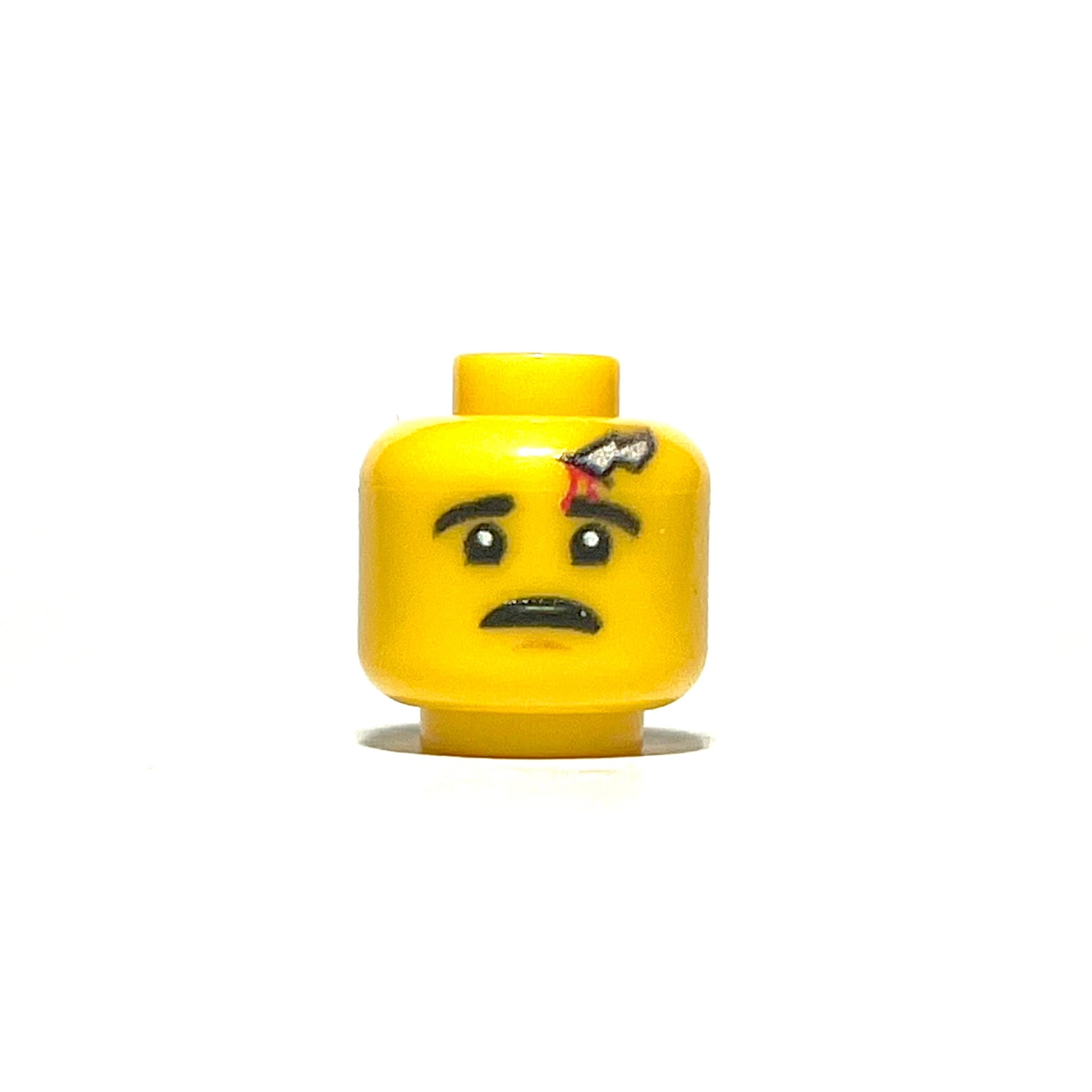 Yellow LEGO minifigure head with worried expression and shrapnel wound detail
