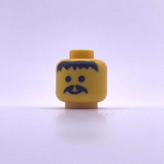 Classic LEGO minifigure head with black beard and hair detailing