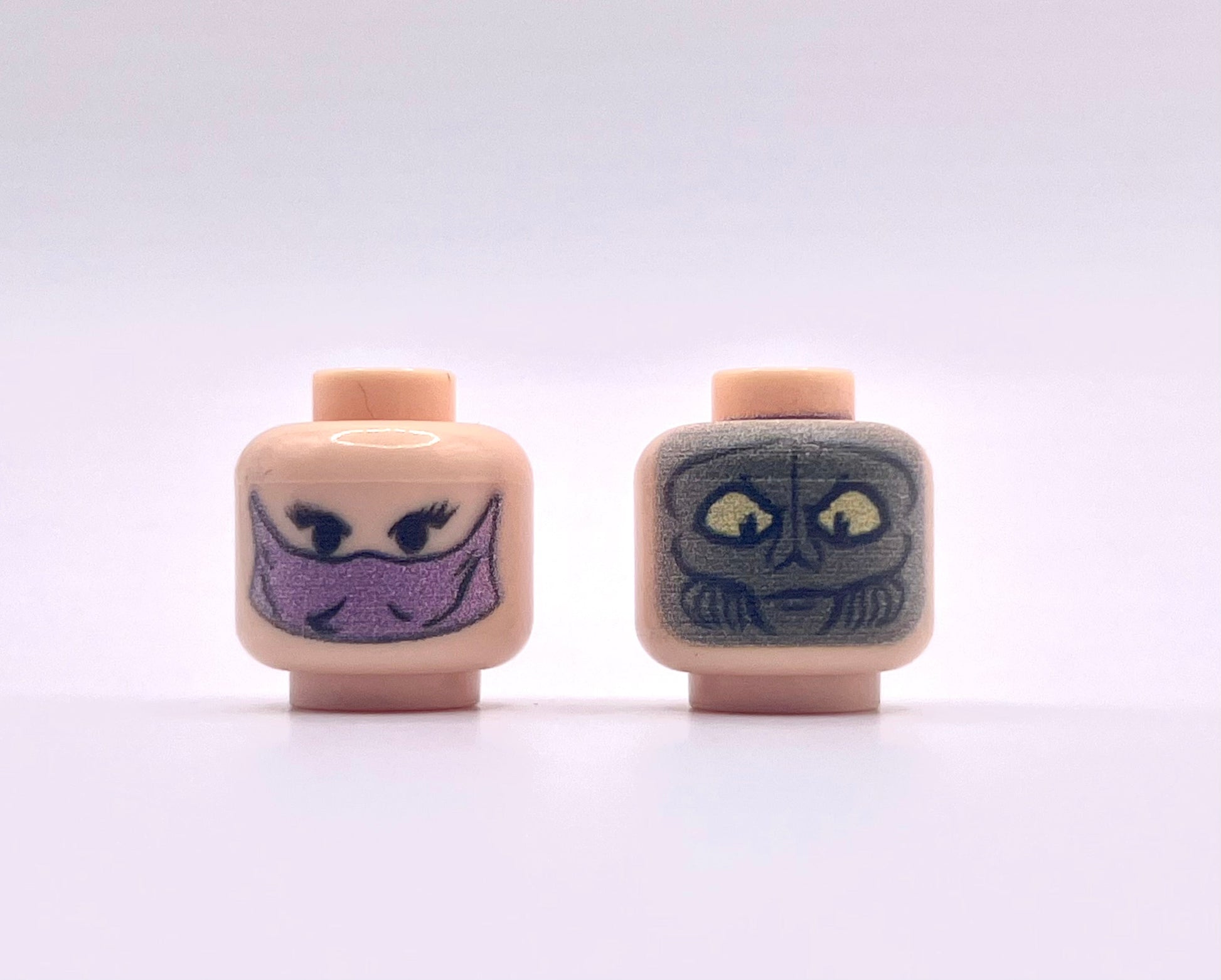 Classic Zamn Head Pack showing two LEGO-style minifigure heads with unique facial expressions on a plain background