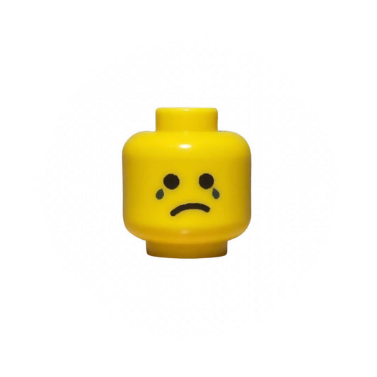 Yellow LEGO minifigure head with crying face and tears expression