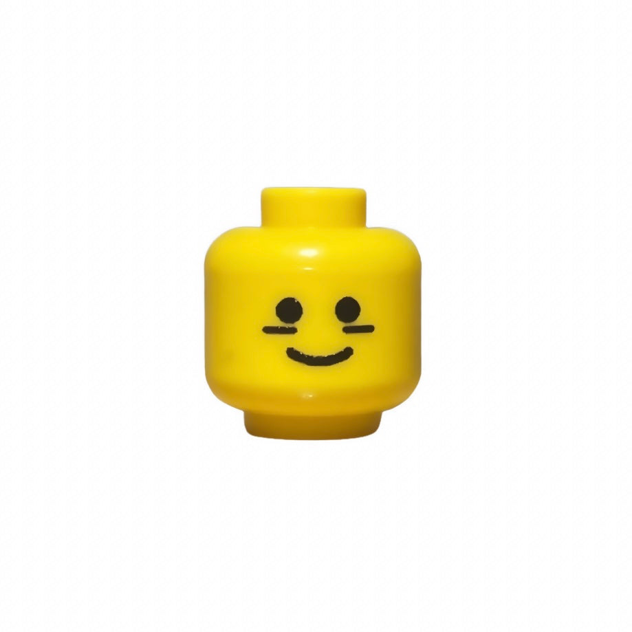 Yellow LEGO football player head with simple smiling face and black markings