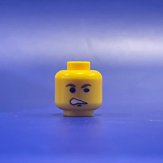 Classic Smuggler Head yellow LEGO minifigure piece with smirking face on blue background