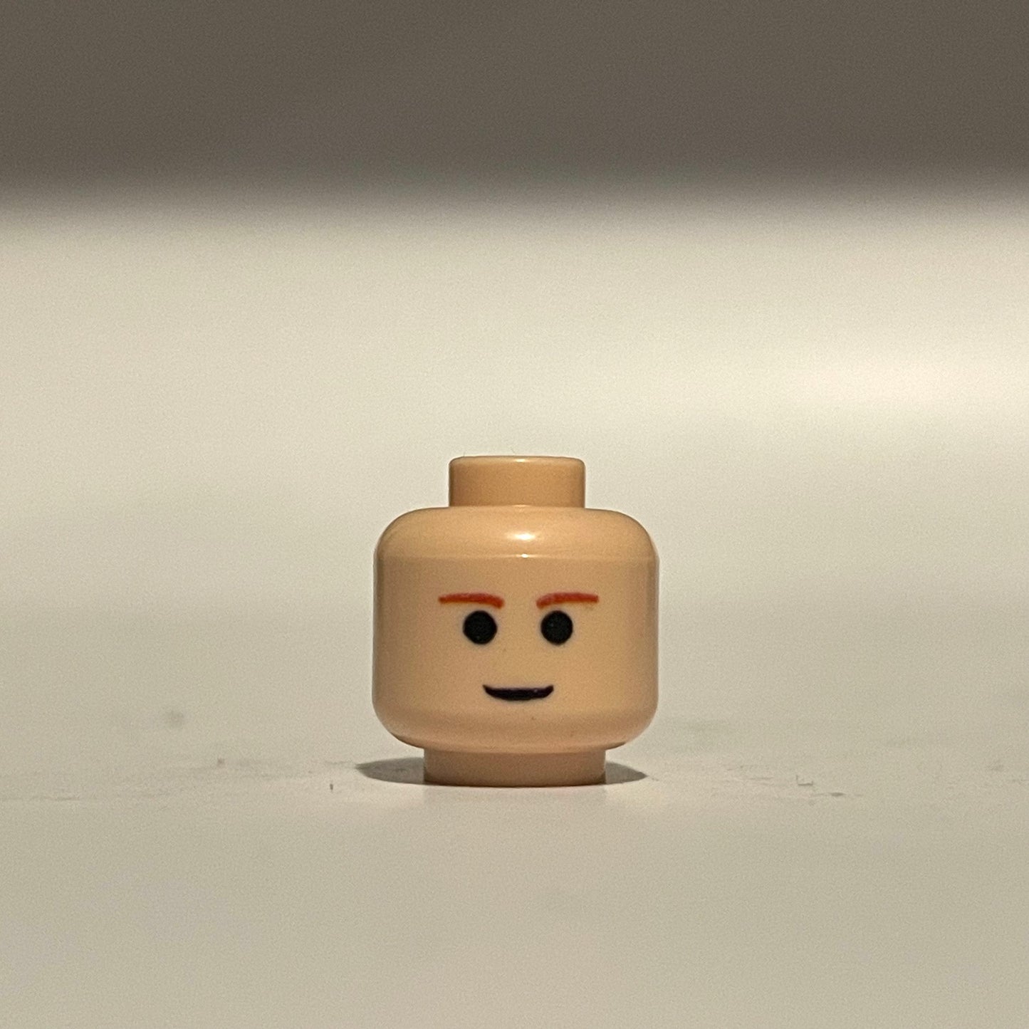 Classic EP2 Ani Head LEGO minifigure head with simple facial expression and orange eyebrows