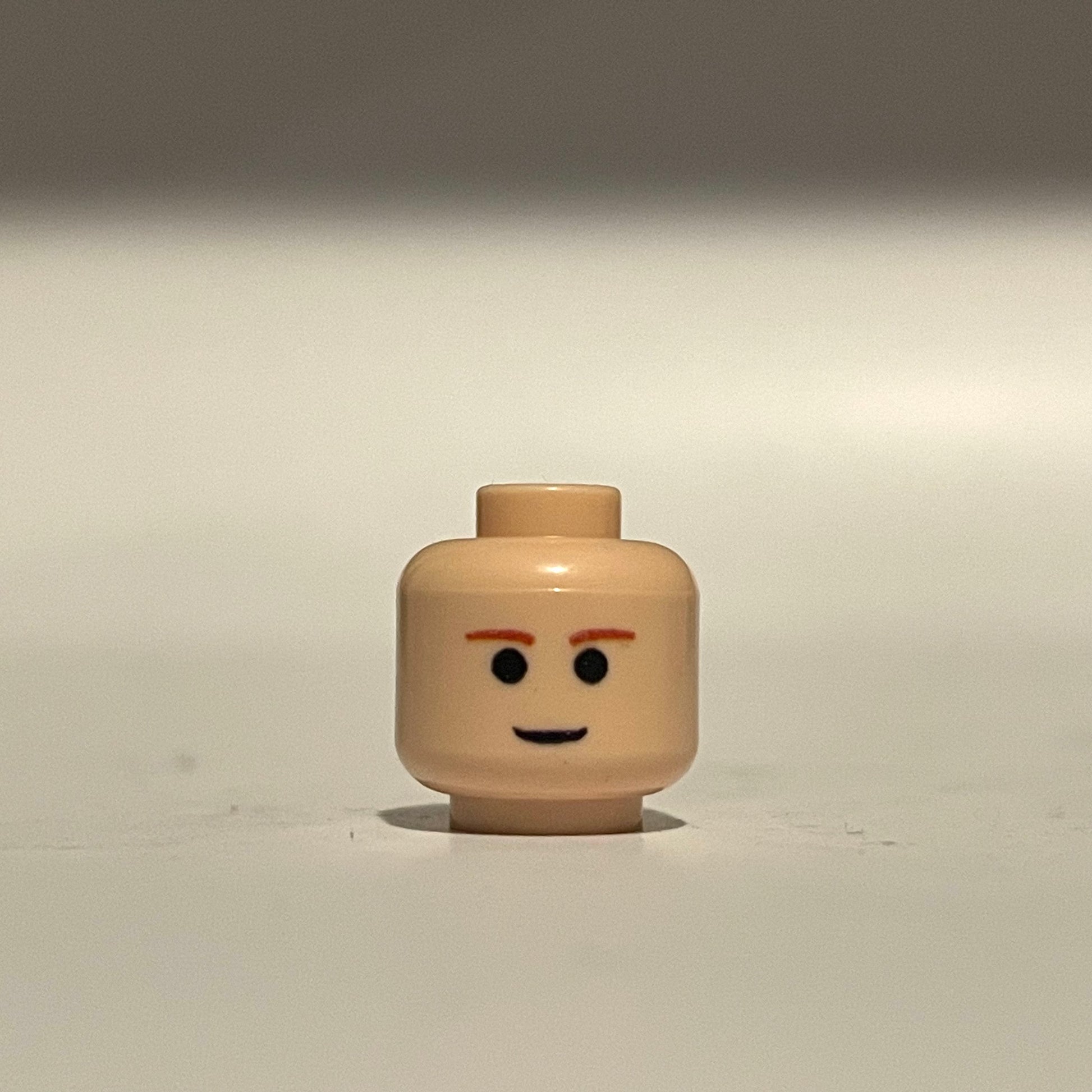 Classic EP2 Ani Head LEGO minifigure head with simple facial expression and orange eyebrows