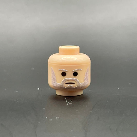 Classic Ben Head LEGO minifigure part with printed beard and eyebrows on a gray background